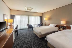 TV a/nebo společenská místnost v ubytování Suikouen Hotel