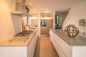 Kuchyň nebo kuchyňský kout v ubytování De Wadden Parel - Villa 184