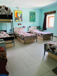 a bedroom with three beds in a room at Lovely Goris in Goris