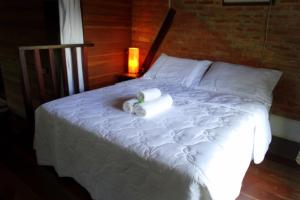Postel nebo postele na pokoji v ubytování Atobá Villas