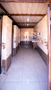 an empty room with a kitchen with sinks in it at Wadi Rum Desert Heart in Wadi Rum