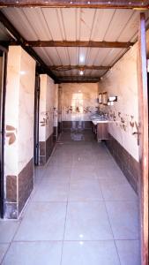 an empty room with a kitchen with sinks in it at Wadi Rum Desert Heart Camp in Wadi Rum +63 photos