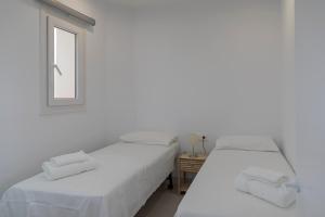 A bed or beds in a room at Primera Línea de Playa - MÁLAGA