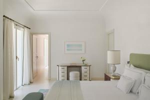 A bed or beds in a room at Hotel La Palma, Oetker Hotels