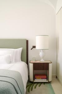 A bed or beds in a room at Hotel La Palma, Oetker Hotels