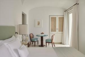 A bed or beds in a room at Hotel La Palma, Oetker Hotels