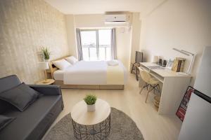 Letto o letti in una camera di RTi Tennoji