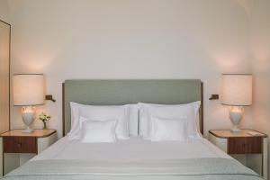 A bed or beds in a room at Hotel La Palma, Oetker Hotels