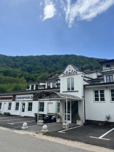 a large white building with a sign on it at River View in Lohovo