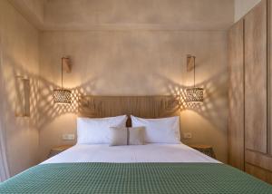 A bed or beds in a room at Terra Oleana Cottages