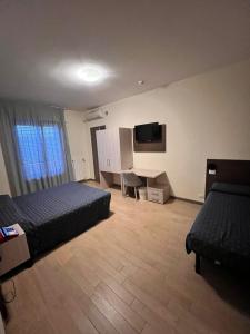TV a/nebo společenská místnost v ubytování Hotel Colonna