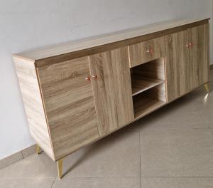 a wooden cabinet withartments in a room at Appartments Meuble SEED in Yaoundé