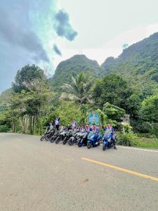 a group of motorcycles parked on the side of the road at Khao Sok Green Mountain View in Khao Sok National Park
