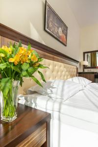 Postel nebo postele na pokoji v ubytování Grand SPA Lietuva Hotel Lietuva