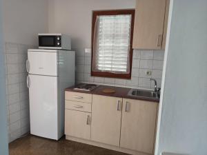 Kuchyň nebo kuchyňský kout v ubytování Vodice, apartmani Buntić