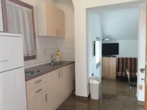 Kuchyň nebo kuchyňský kout v ubytování Vodice, apartmani Buntić