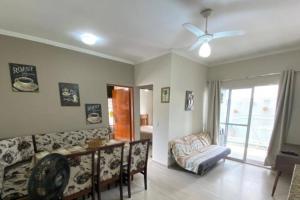 a living room with a couch and a table at Maison Azuos - Charme e mar em perfeita harmonia! in Ubatuba