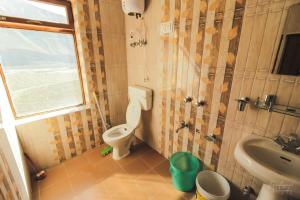 a bathroom with a toilet and a sink at Spiti Homestay by StayApart in Spiti