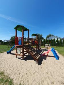 a playground in the sand on the beach at Domki LENA Bobolin in Bobolin