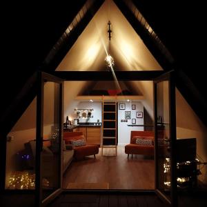 a living room with a large room with a roof at The Hut 45 in Newry