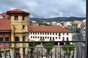 a view of a city with buildings and a street at ETXIE LA CASA TARASKA in Bermeo