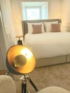 a room with a bed and a table in front of it at Casa de Moledo Beach, Spa & Sauna in Moledo +28 photos