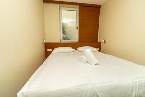 Postel nebo postele na pokoji v ubytování Hotel Düsseldorfer Hof