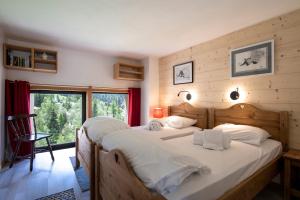 מיטה או מיטות בחדר ב-Résidence Grand Roc - Campanules 311 - Happy Rentals