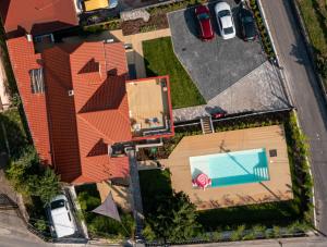 an overhead view of a house with a swimming pool at Stég.Badacsony in Badacsonytomaj