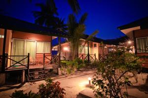 a night view of a house with a courtyard at Tuna Bay Island Resort in Perhentian Islands
