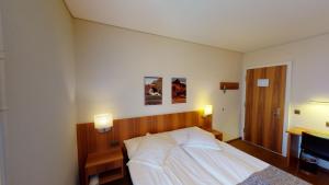 Postel nebo postele na pokoji v ubytování Hotel Ambassador