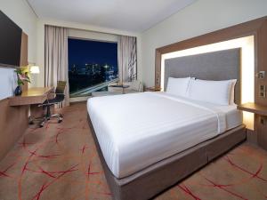 Novotel Ahmedabad客房内的一张或多张床位