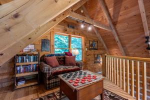 a living room with a couch and a chess board at MountainTime in Vilas