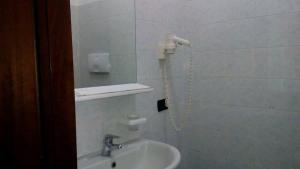 Koupelna v ubytování Hotel Greco