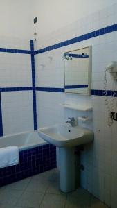 Koupelna v ubytování Hotel Greco