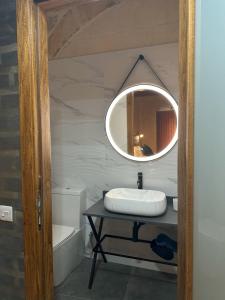 a bathroom with a sink and a mirror at Sea Holly Gozo in Nadur