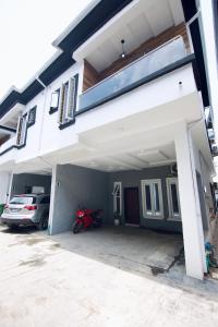 a motorcycle parked in the garage of a house at Oasis Villa Lekki in Lekki