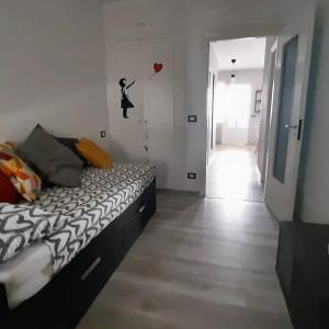 a bedroom with a bed and a room with a balloon at Peter Pan in Castellino Tanaro +16 photos