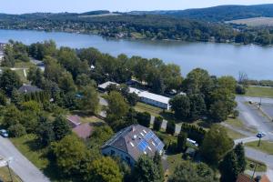 an aerial view of a house next to a lake at Diás Panzió in Orfű