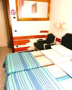 a hotel room with a bed and a chair at Cozy!! Verona in Verona