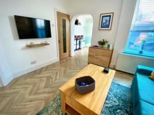 a living room with a couch and a coffee table at The Beach House by Sorted Stay in Southend-on-Sea