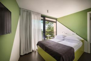 Postel nebo postele na pokoji v ubytování Aminess Vival Casa Lišanj