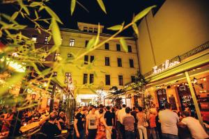 a crowd of people standing in front of a building at Andy's Home Central Apatment in Budapest