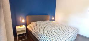 Postel nebo postele na pokoji v ubytování L'appartement du CPW