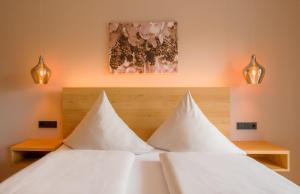 Postel nebo postele na pokoji v ubytování Main-Vinotel Weingut Helmstetter