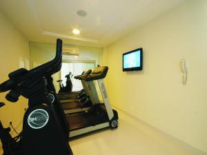 a gym with a treadmill and a television in a room at Hotel Bandeirantes in Rio de Janeiro