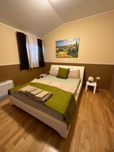Postel nebo postele na pokoji v ubytování Grad Inn Apartments & Resort