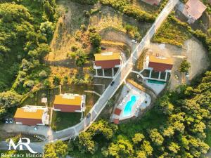 an aerial view of a house and a swimming pool at Residence Mancini - Cilento Home & Sunset in Rocca Cilento +49 photos