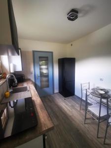 a kitchen and dining room with a table and chairs at Ferienwohnung Waldbröl in Waldbröl