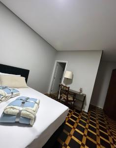 Postel nebo postele na pokoji v ubytování Hotel Dom Marechal neoclássico
